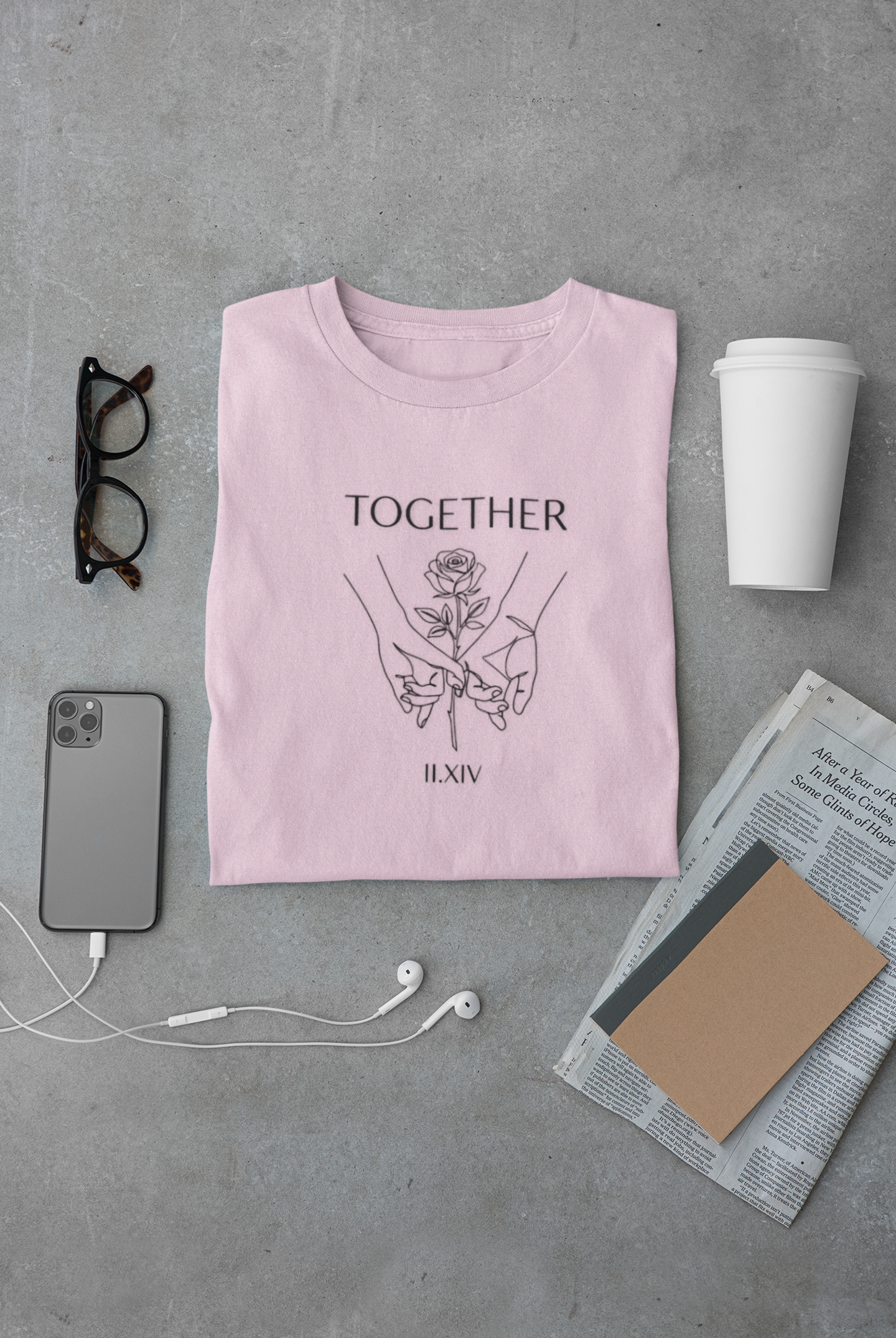 Grey Comfort Colors t-shirt with minimalist black line art of two hands holding a rose. "TOGETHER" text above and "II.XIV" Roman numerals below. Valentine's Day couple graphic tee.
