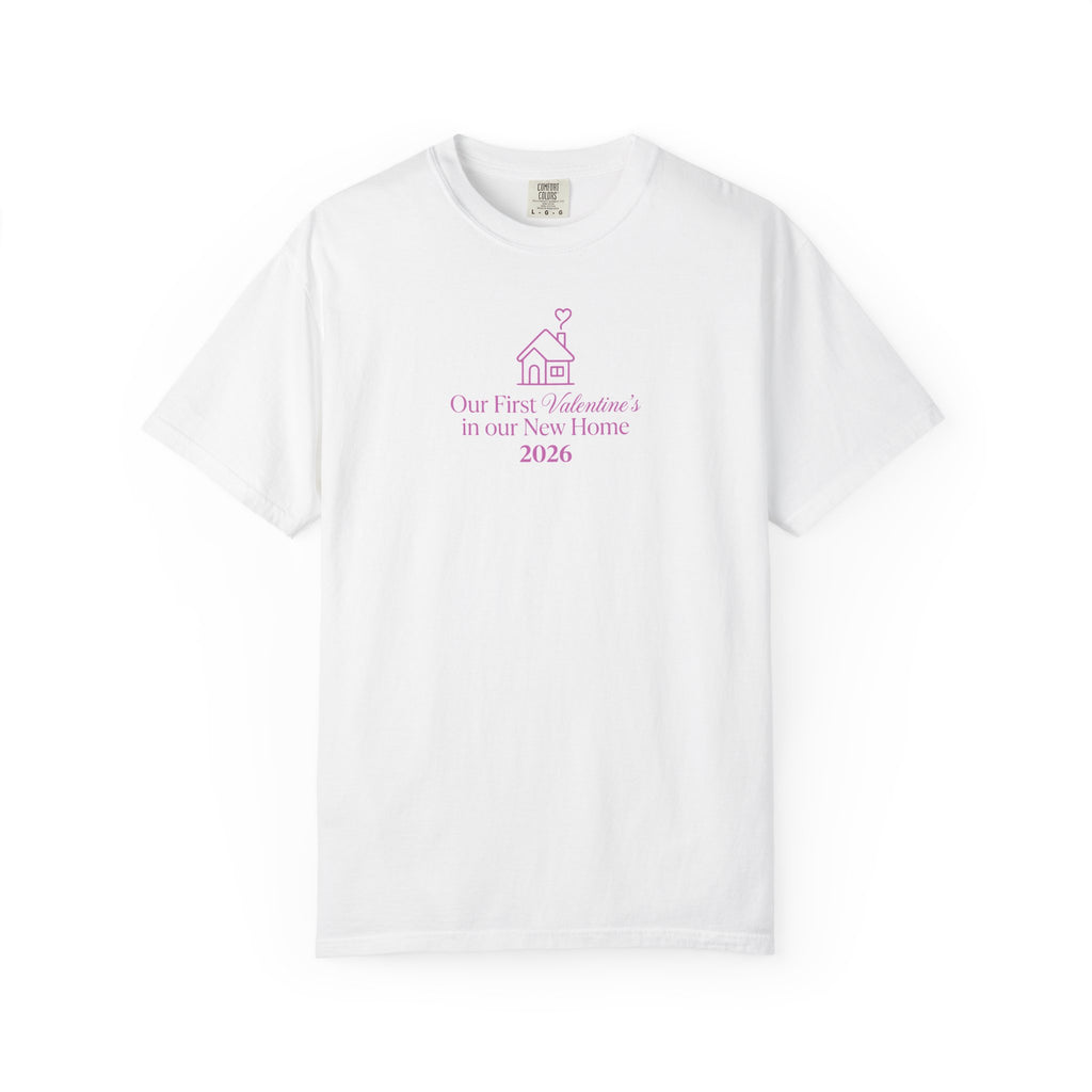 "Our First Valentine's in our New Home 2026 t-shirt, minimalist house graphic with heart smoke, printed on a cream Comfort Colors 1717 garment-dyed shirt."